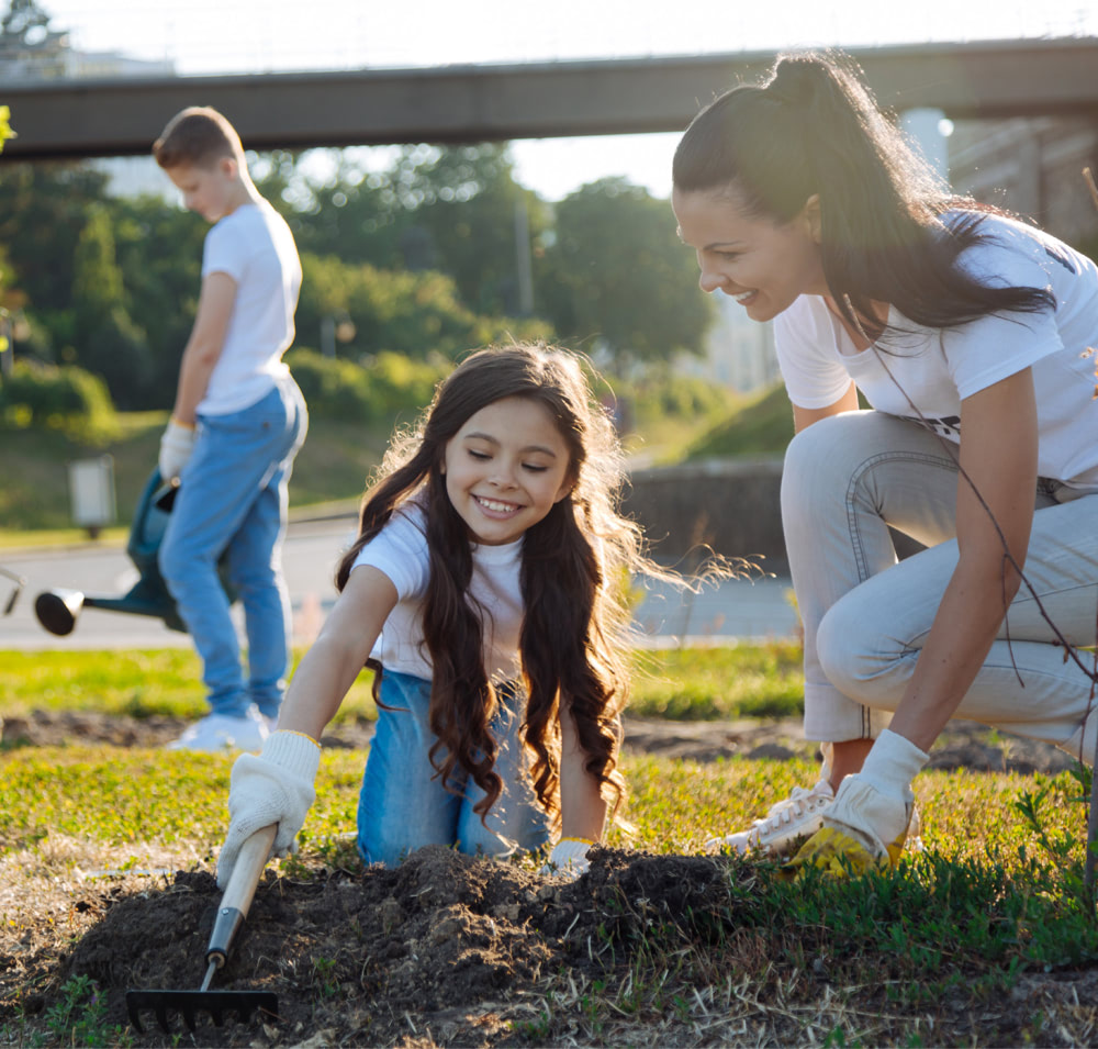 Mother gardening with her child