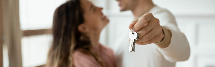 Couple with keys to their new house